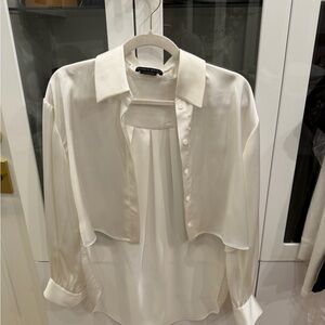 Alice + Olivia Cream Blouse with Button Detail -Cropped front/Long Back